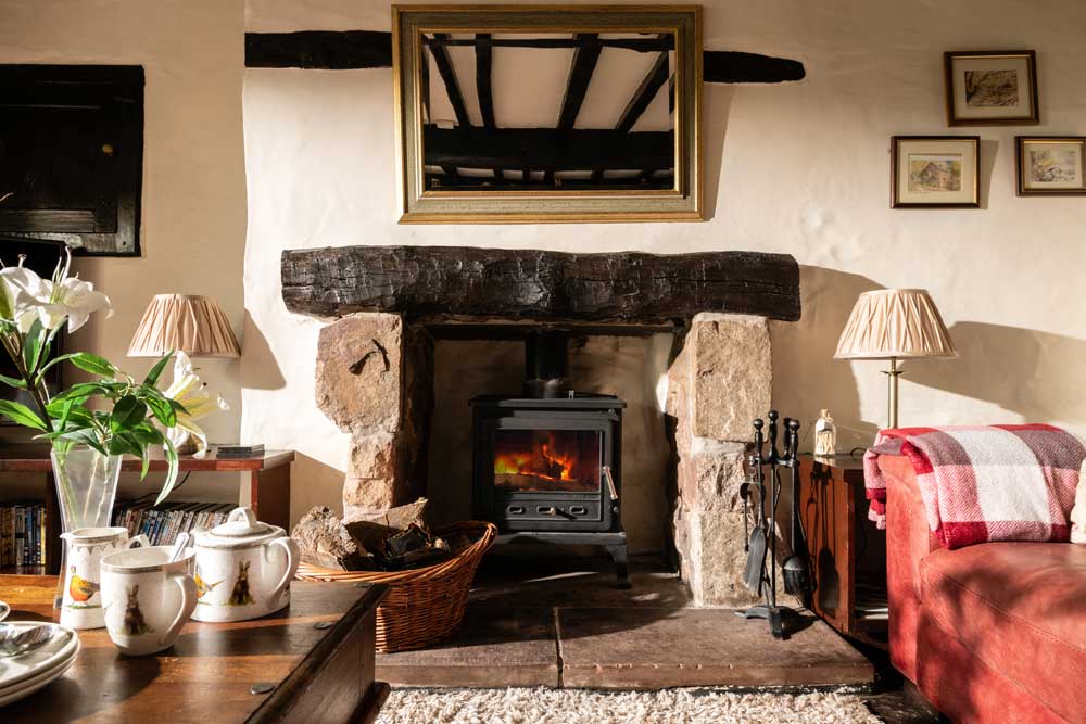 Cozy lounge and log burner in the Farmhouse
