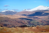Winter view of Boot Village (circled) beneath snowcapped Scafell