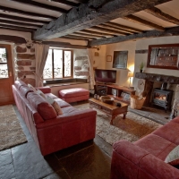 Farmhouse Oak Beamed Living Room with cosy woodburner