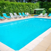 Sun Loungers beside our heated swimming pool 