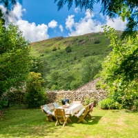 Chill in the Farmhouse garden and soak up the fell views.